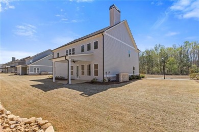 Nestled in the sought-after Traditions of Braselton community on Traditions of Braselton Golf Club in Georgia - for sale on GolfHomes.com, golf home, golf lot