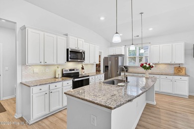 Living is easy in this Nearly New Tasteful Open-Concept on Brunswick Plantation and Golf Resorts in North Carolina - for sale on GolfHomes.com, golf home, golf lot