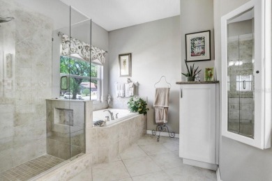 Under contract-accepting backup offers. Immaculate Pool Home on on The Eagles Golf Course and Club in Florida - for sale on GolfHomes.com, golf home, golf lot