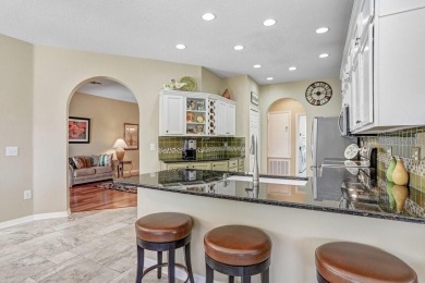 Under contract-accepting backup offers. Immaculate Pool Home on on The Eagles Golf Course and Club in Florida - for sale on GolfHomes.com, golf home, golf lot