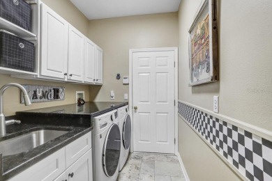 Under contract-accepting backup offers. Immaculate Pool Home on on The Eagles Golf Course and Club in Florida - for sale on GolfHomes.com, golf home, golf lot