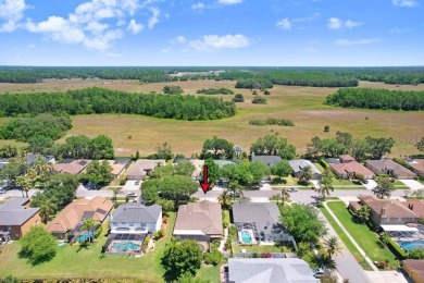 Under contract-accepting backup offers. Immaculate Pool Home on on The Eagles Golf Course and Club in Florida - for sale on GolfHomes.com, golf home, golf lot
