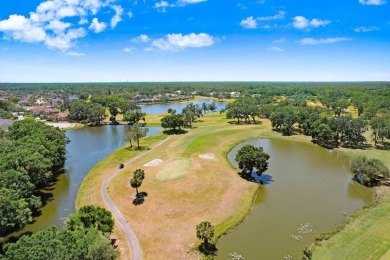 Under contract-accepting backup offers. Immaculate Pool Home on on The Eagles Golf Course and Club in Florida - for sale on GolfHomes.com, golf home, golf lot