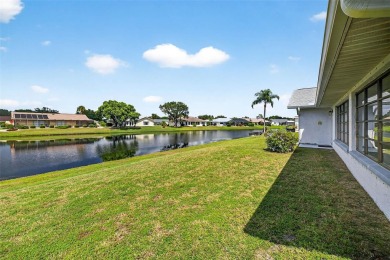 Serene Pond View  Sunlit Elegance in Sun City Center's Premier on North Lakes Golf Course in Florida - for sale on GolfHomes.com, golf home, golf lot