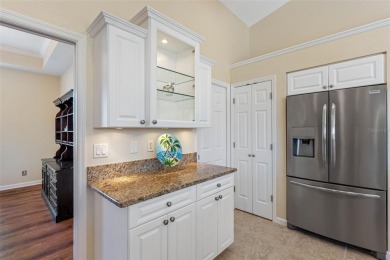 Nestled in a highly sought-after executive golf course community on Pinemoor West Golf Club in Florida - for sale on GolfHomes.com, golf home, golf lot