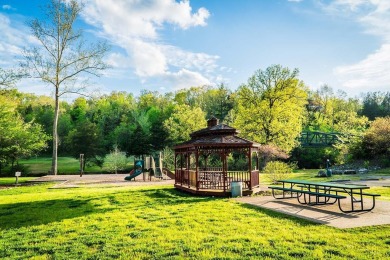 This beautifully appointed 2-bedroom, 2-bathroom fully furnished on Ledgestone Country Club and Golf Course in Missouri - for sale on GolfHomes.com, golf home, golf lot