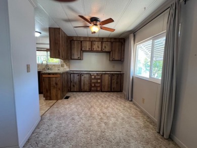 Discover comfort and convenience in this inviting 2-bedroom on Tucker Oaks Golf Course in California - for sale on GolfHomes.com, golf home, golf lot