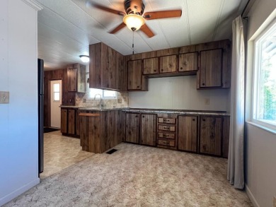 Discover comfort and convenience in this inviting 2-bedroom on Tucker Oaks Golf Course in California - for sale on GolfHomes.com, golf home, golf lot