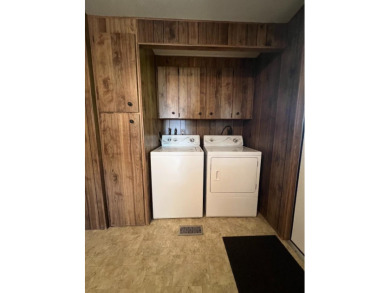 Discover comfort and convenience in this inviting 2-bedroom on Tucker Oaks Golf Course in California - for sale on GolfHomes.com, golf home, golf lot