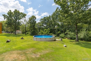Welcome to your dream home in the sought-after Terre Du Lac on Terre Du Lac Golf and Country Club in Missouri - for sale on GolfHomes.com, golf home, golf lot