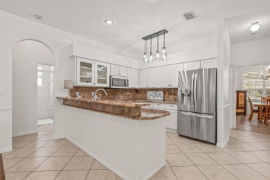 Welcome to your dream home in the gated community of East Lake on East Lake Woodlands Country Club in Florida - for sale on GolfHomes.com, golf home, golf lot