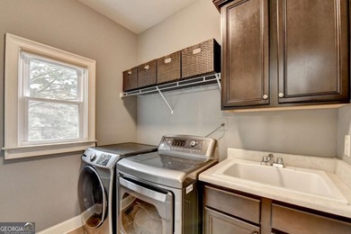 Welcome to this beautifully maintained four-sided BRICK ESTATE on Windermere Golf Club in Georgia - for sale on GolfHomes.com, golf home, golf lot