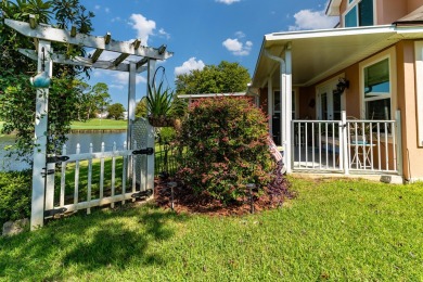 This inviting home, nestled on a small lake along the 3rd on Shalimar Pointe Golf and Country Club in Florida - for sale on GolfHomes.com, golf home, golf lot