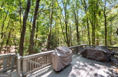 This is a light and bright, fully renovated, real log cabin in on Big Canoe Golf Club - Cherokee in Georgia - for sale on GolfHomes.com, golf home, golf lot