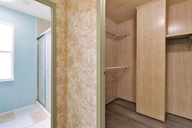 PRICE IMPROVEMENT: FLOWER Section/BAREFOOT BAY - CORNER LOT with on Barefoot Bay Golf Course in Florida - for sale on GolfHomes.com, golf home, golf lot