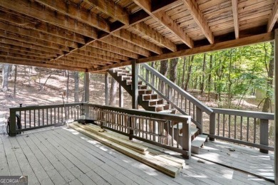 This is a light and bright, fully renovated, real log cabin in on Big Canoe Golf Club - Cherokee in Georgia - for sale on GolfHomes.com, golf home, golf lot