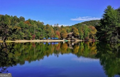 This is a light and bright, fully renovated, real log cabin in on Big Canoe Golf Club - Cherokee in Georgia - for sale on GolfHomes.com, golf home, golf lot