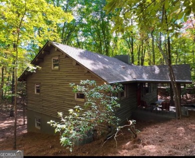This is a light and bright, fully renovated, real log cabin in on Big Canoe Golf Club - Cherokee in Georgia - for sale on GolfHomes.com, golf home, golf lot
