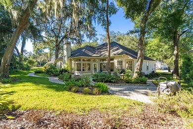 Enjoy a peaceful backyard with mature trees surrounding this on Country Club of Orange Park in Florida - for sale on GolfHomes.com, golf home, golf lot