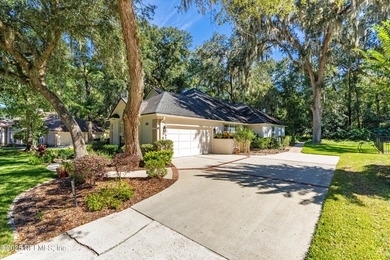 Enjoy a peaceful backyard with mature trees surrounding this on Country Club of Orange Park in Florida - for sale on GolfHomes.com, golf home, golf lot