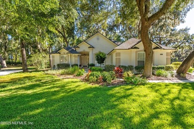 Enjoy a peaceful backyard with mature trees surrounding this on Country Club of Orange Park in Florida - for sale on GolfHomes.com, golf home, golf lot