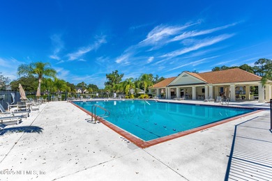 Enjoy a peaceful backyard with mature trees surrounding this on Country Club of Orange Park in Florida - for sale on GolfHomes.com, golf home, golf lot