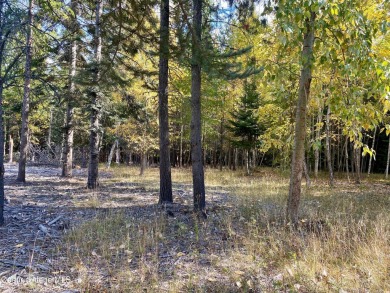 Beautifully parked out wooded level 5 acre parcel in Wilderness on Mirror Lake Golf Course in Idaho - for sale on GolfHomes.com, golf home, golf lot