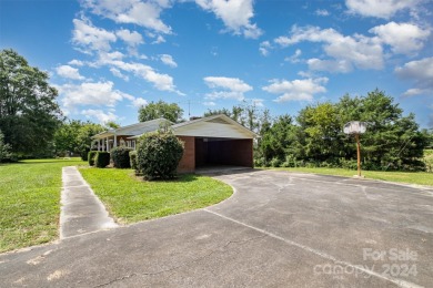 Over 9 acres of beautiful pasture with gentle rolling hills on Woodbridge Golf Links in North Carolina - for sale on GolfHomes.com, golf home, golf lot