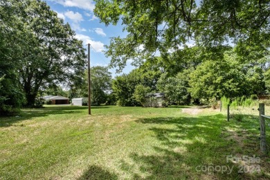 Over 9 acres of beautiful pasture with gentle rolling hills on Woodbridge Golf Links in North Carolina - for sale on GolfHomes.com, golf home, golf lot