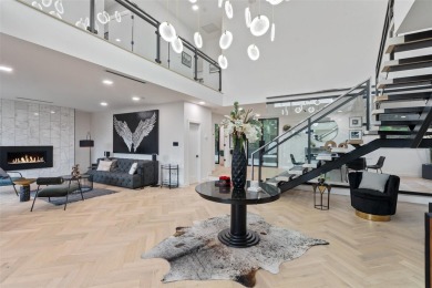 Bold, sophisticated, and move-in ready -- this natural modern on Austin Country Club in Texas - for sale on GolfHomes.com, golf home, golf lot