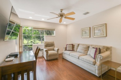 Nestled within the serene and exclusive Harbour Ridge Yacht & on Harbour Ridge Yacht and Country Club in Florida - for sale on GolfHomes.com, golf home, golf lot