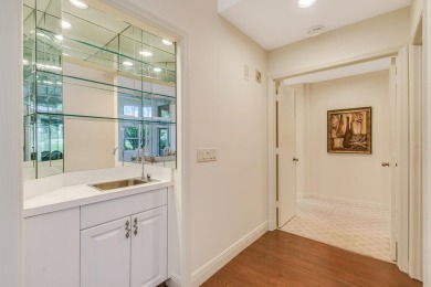 Nestled within the serene and exclusive Harbour Ridge Yacht & on Harbour Ridge Yacht and Country Club in Florida - for sale on GolfHomes.com, golf home, golf lot
