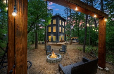 *The Howling Wolf* is a towering getaway cabin at the end of the on Cedar Creek Golf Course At Beavers Bend State Park in Oklahoma - for sale on GolfHomes.com, golf home, golf lot