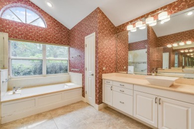 Nestled within the serene and exclusive Harbour Ridge Yacht & on Harbour Ridge Yacht and Country Club in Florida - for sale on GolfHomes.com, golf home, golf lot