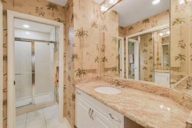 Nestled within the serene and exclusive Harbour Ridge Yacht & on Harbour Ridge Yacht and Country Club in Florida - for sale on GolfHomes.com, golf home, golf lot