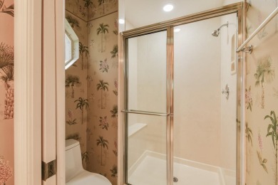 Nestled within the serene and exclusive Harbour Ridge Yacht & on Harbour Ridge Yacht and Country Club in Florida - for sale on GolfHomes.com, golf home, golf lot