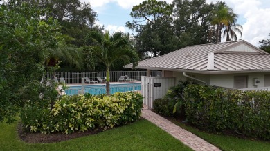 Nestled within the serene and exclusive Harbour Ridge Yacht & on Harbour Ridge Yacht and Country Club in Florida - for sale on GolfHomes.com, golf home, golf lot