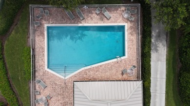 Nestled within the serene and exclusive Harbour Ridge Yacht & on Harbour Ridge Yacht and Country Club in Florida - for sale on GolfHomes.com, golf home, golf lot