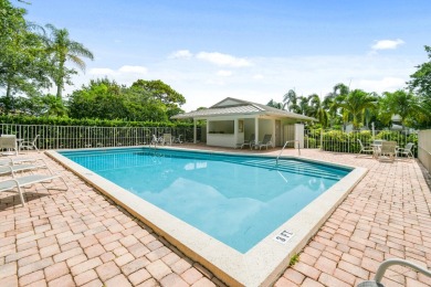 Nestled within the serene and exclusive Harbour Ridge Yacht & on Harbour Ridge Yacht and Country Club in Florida - for sale on GolfHomes.com, golf home, golf lot