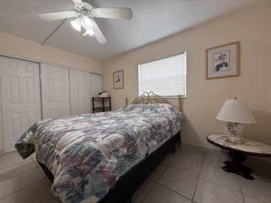 Ground floor 2 bedroom, 2 bath true corner unit with canal view on Addison Reserve in Florida - for sale on GolfHomes.com, golf home, golf lot