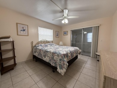 Ground floor 2 bedroom, 2 bath true corner unit with canal view on Addison Reserve in Florida - for sale on GolfHomes.com, golf home, golf lot
