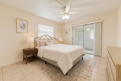 Ground floor 2 bedroom, 2 bath true corner unit with canal view on Addison Reserve in Florida - for sale on GolfHomes.com, golf home, golf lot