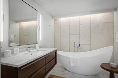 Developed as luxury condominiums in 2019, Hapuna Beach on Hapuna Golf Course in Hawaii - for sale on GolfHomes.com, golf home, golf lot