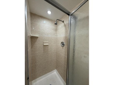 Ground floor 2 bedroom, 2 bath true corner unit with canal view on Addison Reserve in Florida - for sale on GolfHomes.com, golf home, golf lot
