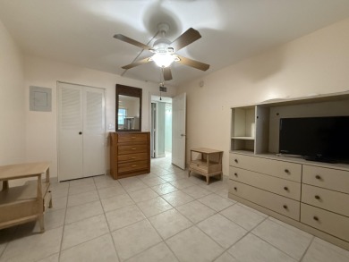 Ground floor 2 bedroom, 2 bath true corner unit with canal view on Addison Reserve in Florida - for sale on GolfHomes.com, golf home, golf lot