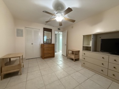 Ground floor 2 bedroom, 2 bath true corner unit with canal view on Addison Reserve in Florida - for sale on GolfHomes.com, golf home, golf lot