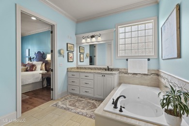 Beautiful waterfront home in the gated community of the Shores on Lake Caroline Golf Club in Mississippi - for sale on GolfHomes.com, golf home, golf lot