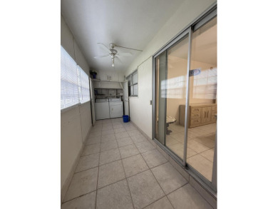 Ground floor 2 bedroom, 2 bath true corner unit with canal view on Addison Reserve in Florida - for sale on GolfHomes.com, golf home, golf lot