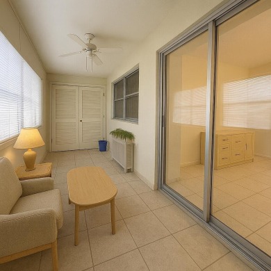 Ground floor 2 bedroom, 2 bath true corner unit with canal view on Addison Reserve in Florida - for sale on GolfHomes.com, golf home, golf lot
