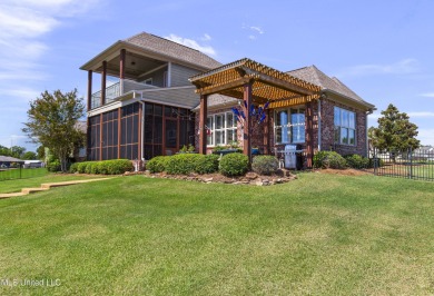 Beautiful waterfront home in the gated community of the Shores on Lake Caroline Golf Club in Mississippi - for sale on GolfHomes.com, golf home, golf lot